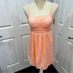 Wet Seal peach eyelet spaghetti strap mini dress. Lined, ruching at chest & back